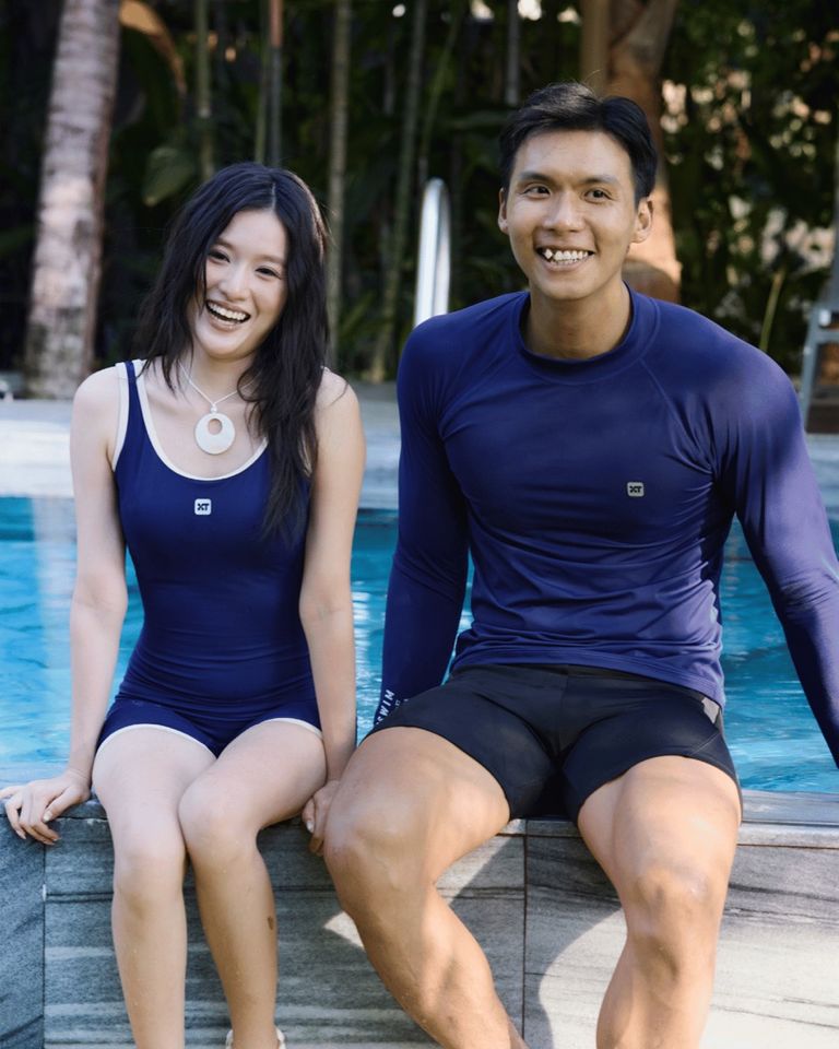 Women's sport one-piece; men's long-sleeve rash guard and shorts